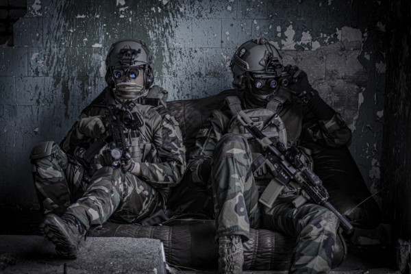 Officers sitting on a sofa military zoom background